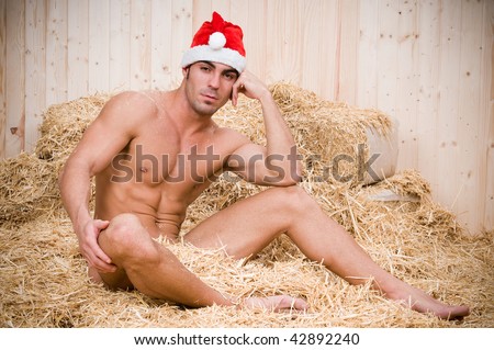 stock-photo-sexy-muscled-male-santa-claus-sitting-in-his-barn-42892240.jpg